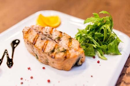 European international fusion cuisine, a beautiful dish on a white plate decorated with herbs and...