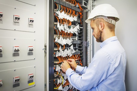 Engineer in server room of datacenter. Networking service. network engineer administrator checking...