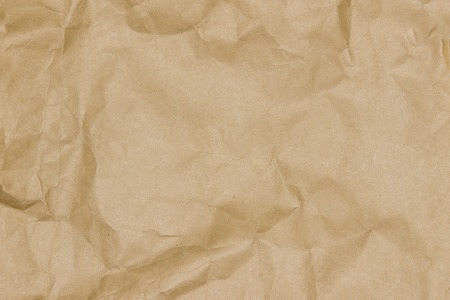 Old brown crumpled textured paperの写真素材