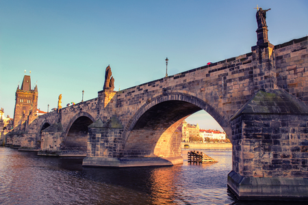 Charles Bridge over the Vltava River in Prague. Old Town pier architecture in Prague in the evening with clear summer sky, Czech Republicの写真素材
