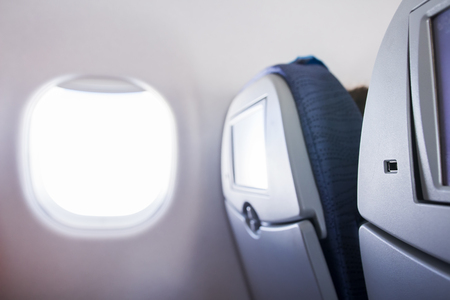 Seats and window in the cabin of plane. Interior of aircraftの写真素材