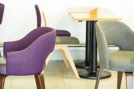 Beautiful cozy armchairs in interior of cafe. Chairs and tables in cafe. Upholstered furniture in restaurantの写真素材