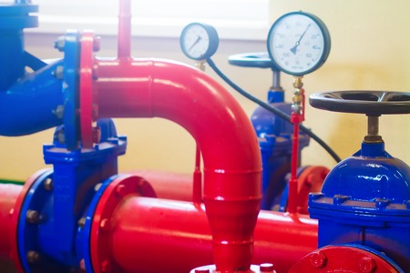Industrial pipes and pressure sensors at factory. Pipeline valveの写真素材