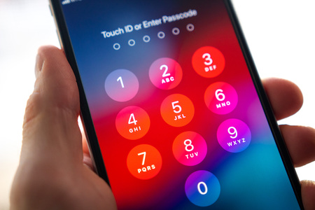 Minsk, Belarus - 10, february: Enter password or Touch id on smartphone screen. Security pass in app...