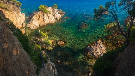 Lloret de Mar sea coast with cliffs in water. Spain blue lagoon in Costa Bravaの写真素材