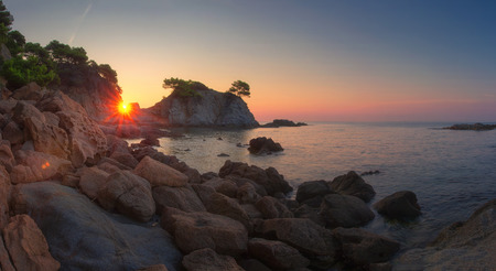 Panoramic landscape of beach at sunrise in Lloret de Mar, Spain coast. Costa Brava sea nature in morning sunshineの写真素材
