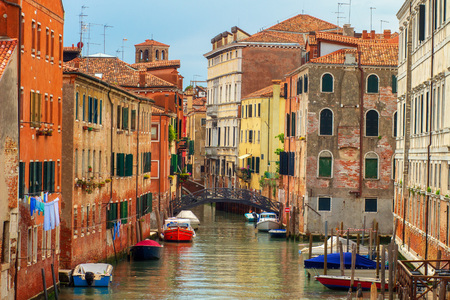 Venice street cityscape, Italy. Old Venice town with boats in water canal.の写真素材