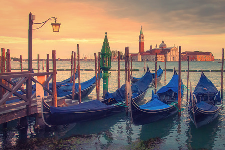 Venice landscape with gondolas at sunset, Italy. Beautiful view on San Giorgio di Maggiore church in Venice, Italyの写真素材