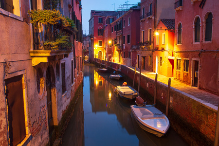 Venice at night. Boats in canal street houses in water. Venice night cityscape, Italyの写真素材