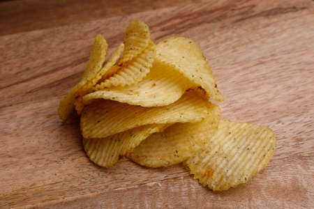 chips on wooden background close upの写真素材