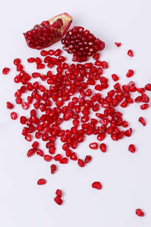 pomegranate seeds isolated on white background. top view. pomegranate berries.の写真素材