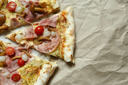 pizza with mushrooms, brisket and sausage on paperの写真素材