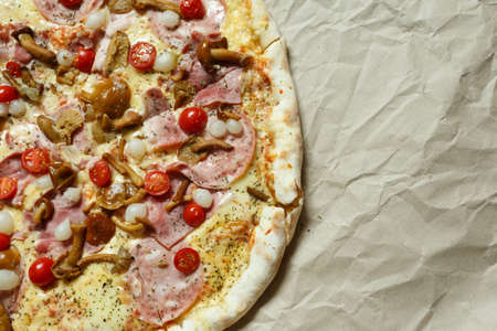pizza with mushrooms, brisket and sausage on paperの写真素材