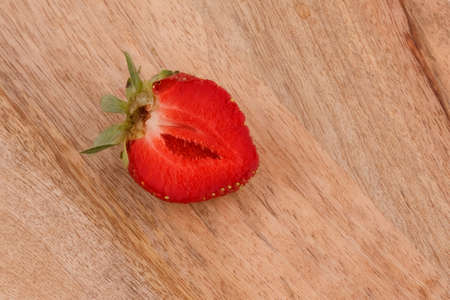 strawberry closeup on a wooden boardの写真素材
