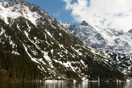 view of the lake Morskie Oko, mountains in the national park in the Tatra Mountainsの写真素材