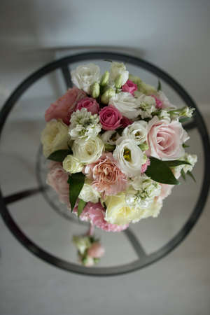 bouquet of wedding flowers close-up on a glass tableの写真素材