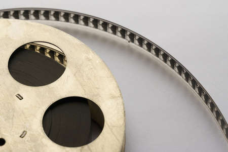 Film strip and iron cassette on a white background. Close-upの写真素材