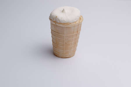 Vanilla ice cream in waffle cup isolated on white