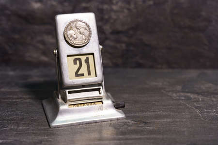Soviet metal retro calendar. Dark background.