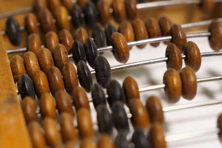 Wooden abacus on a white background. Close-upの写真素材