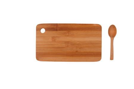 Kitchen cutting board and wooden spoon. Objects on a white background. View from aboveの写真素材
