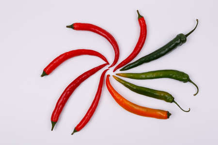 Red, yellow and green chili pepper isolated on a white background.の写真素材
