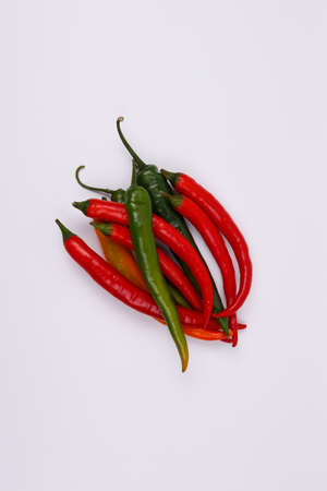 Red and green chili pepper isolated on a white background.