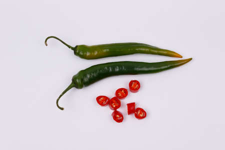 green and red hot chili peppers isolated on a white background. View from above. Flat lay