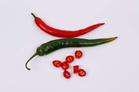 green and red hot chili peppers isolated on a white background. View from above. Flat layの写真素材