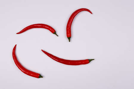 Red hot little chili peppers pattern isolated on white background. Top view. Flat layの写真素材