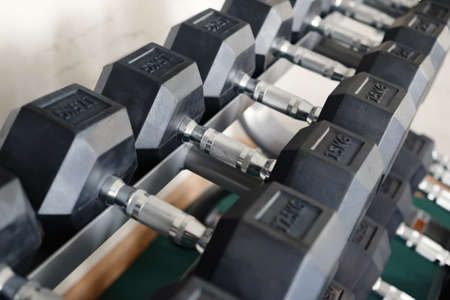 A row of dumbbells. View from above. Perspective