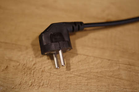 Electric plug on the kitchen table. Close-up