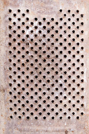 The texture of iron with holes. Grater. Close-up.の写真素材