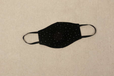 Doctor mask and protection against crown viruses, on a beige fabric backgroundの写真素材
