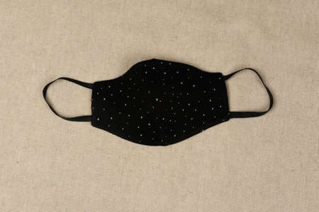 Doctor mask and protection against crown viruses, on a beige fabric backgroundの写真素材