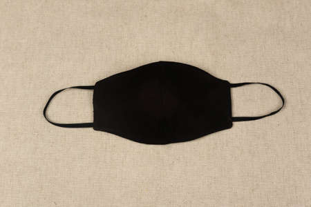 Doctor mask and protection against crown viruses, on a beige fabric backgroundの写真素材