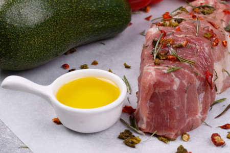 Fresh meat and vegetables for cooking your favorite dishes on a light background. View from above.の写真素材