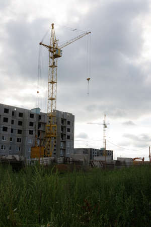 Construction of a residential building with cranesの写真素材