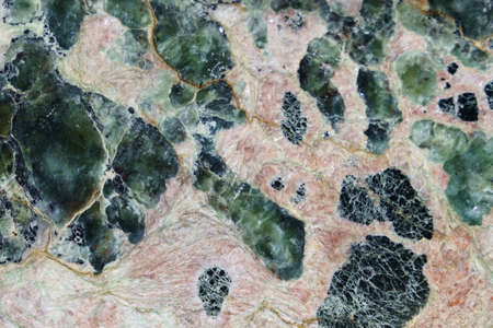 The texture of polished stone. White surface with various shades, mainly white and greenの写真素材