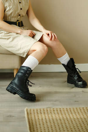 Military shoes on the girlâs legs. Side viewの写真素材