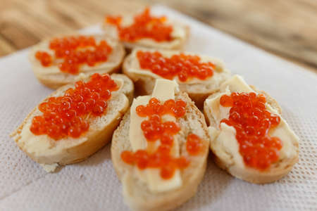Sandwich with butter and red salmon caviar. View from aboveの写真素材