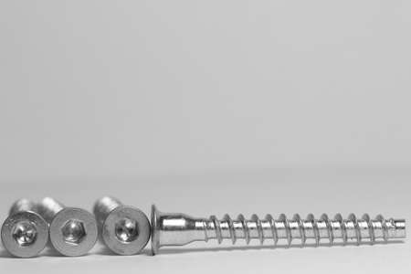 Screws closeup on white background. Isolated