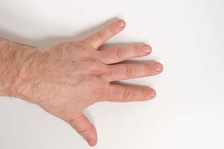 Men hand on a white background. Close-up. Isolateの写真素材