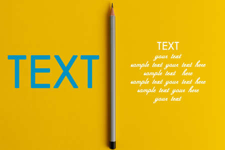 An interactive photo composition of gray pencil and space for creative thinking (text) is used for presentation in the field of education, business or creativity. Lighting on a pencil in the studio. Yellow backgroundの写真素材