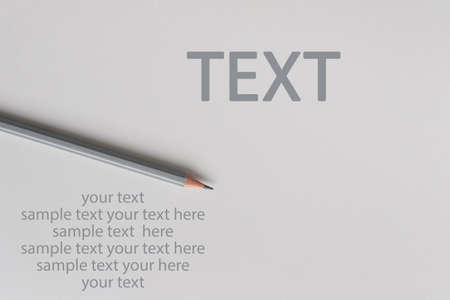 An interactive photo composition of gray pencil and space for creative thinking (text) is used for presentation in the field of education, business or creativity. Lighting on a pencil in the studio. White backgroundの写真素材