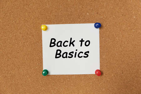 Text Back to Basics written on a sticker pinned on a cork boardの写真素材