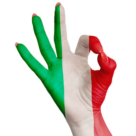 Italy national flag painted on female hand showing ok sign. Image on a white backgroundの写真素材