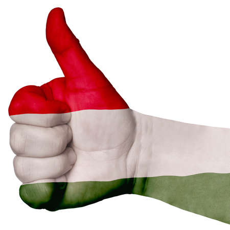 Hand with thumb up gesture in colored italy national flag as symbol of excellence, achievement, good, - useful for tourism and touristic advertisingの写真素材