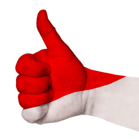 Hand with thumb up gesture in colored poland national flag as symbol of excellence, achievement, good, - useful for tourism and touristic advertisingの写真素材