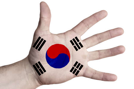 Open palm with the image of the flag of South Korea. Multipurpose concept. Image on a white background. Isolateの写真素材